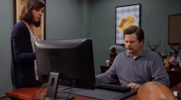 Parks and Recreation GIF with Ron Swanson, a middle-aged man with a mustache, looking disgusted to a computer followed by a zoom to his face, and then he is on an alley throwing that computer.